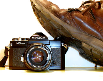 A boot stamping on a camera... forever. Yes, I know this is an SLR. But I was using the digital camera to take the photo!