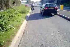 Pinch point with car overtaking cyclist